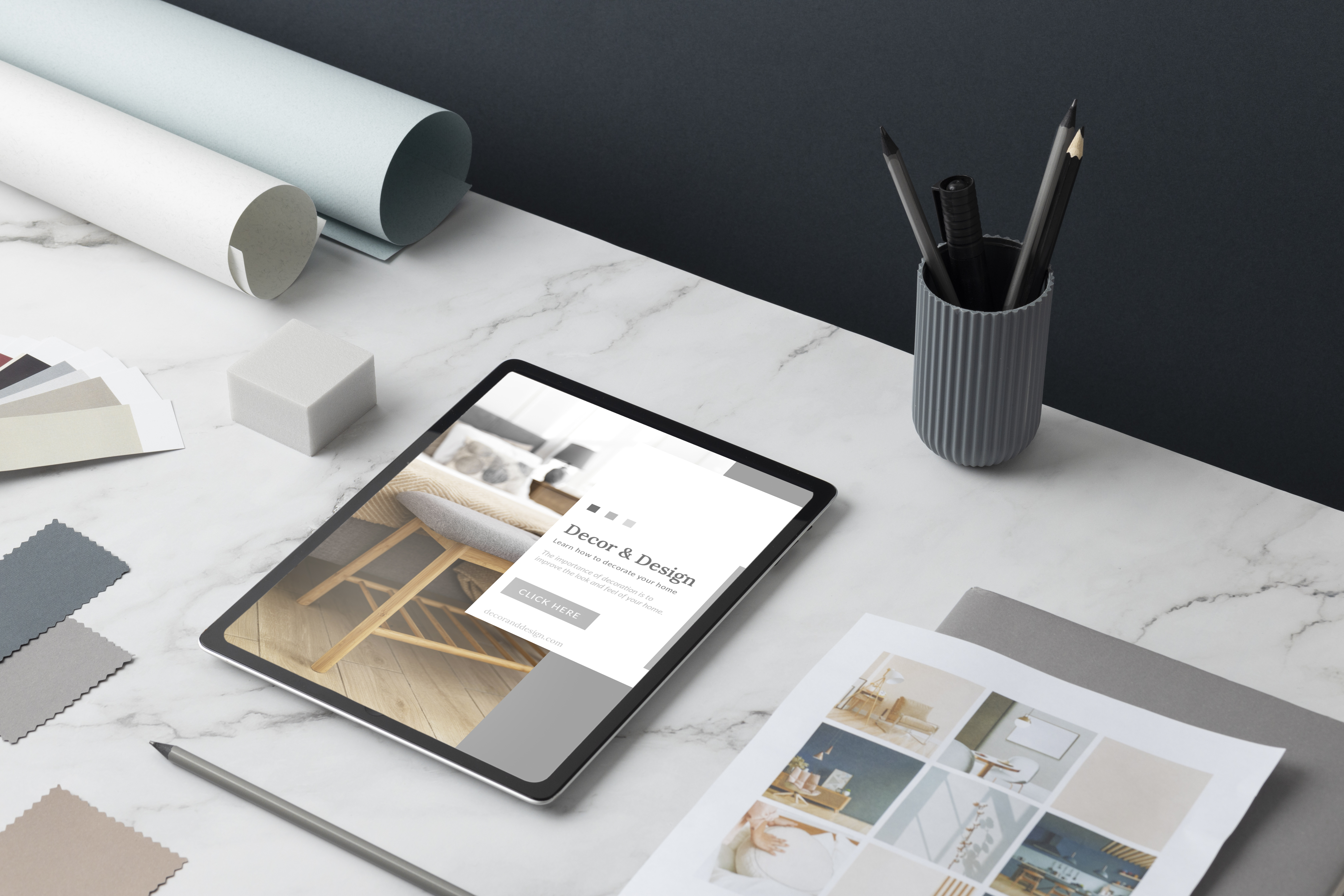 Portfolio overview — tablet showing design work on a marble desk.